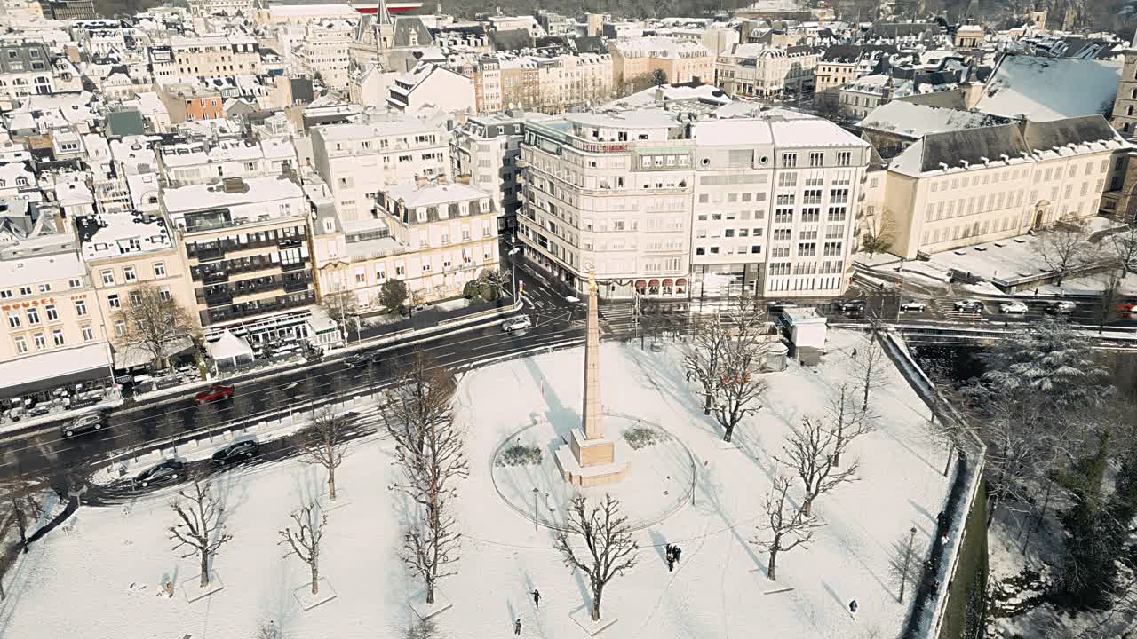 Captivating drone footage showcasing Luxembourg covered in snow by the golden lady