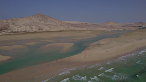 Sotavento-Beach,-Fuerteventura:-aerial-view-in-orbit-of-the-fantastic-beach-on-a-sunny-day