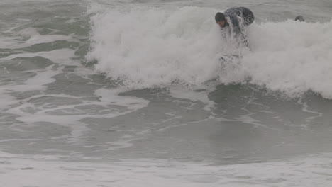 male surfer riding a wave