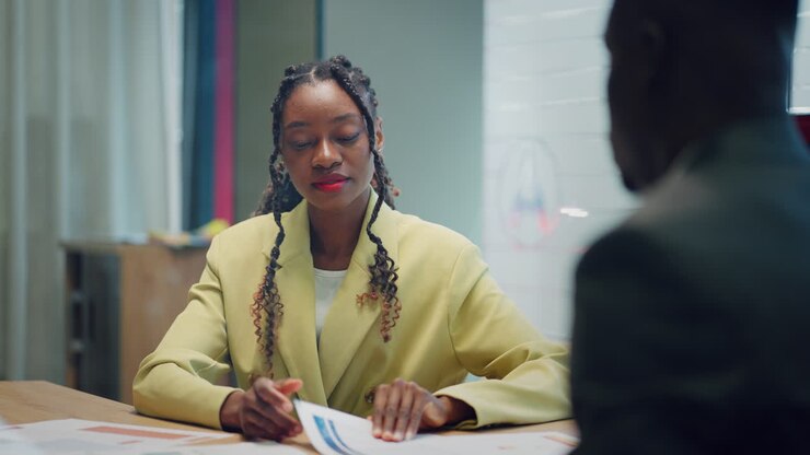 black businesswoman and black businessman are negotiating in office job interview or consultation