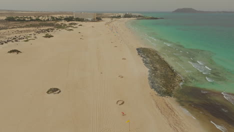 flying over the sand of corralejo beach on a sunny day