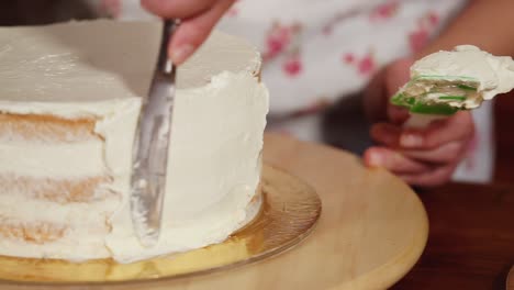person decorating a cake