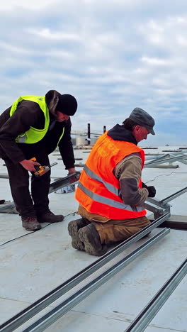 exterior solar system installation. professional technician installing metal platform