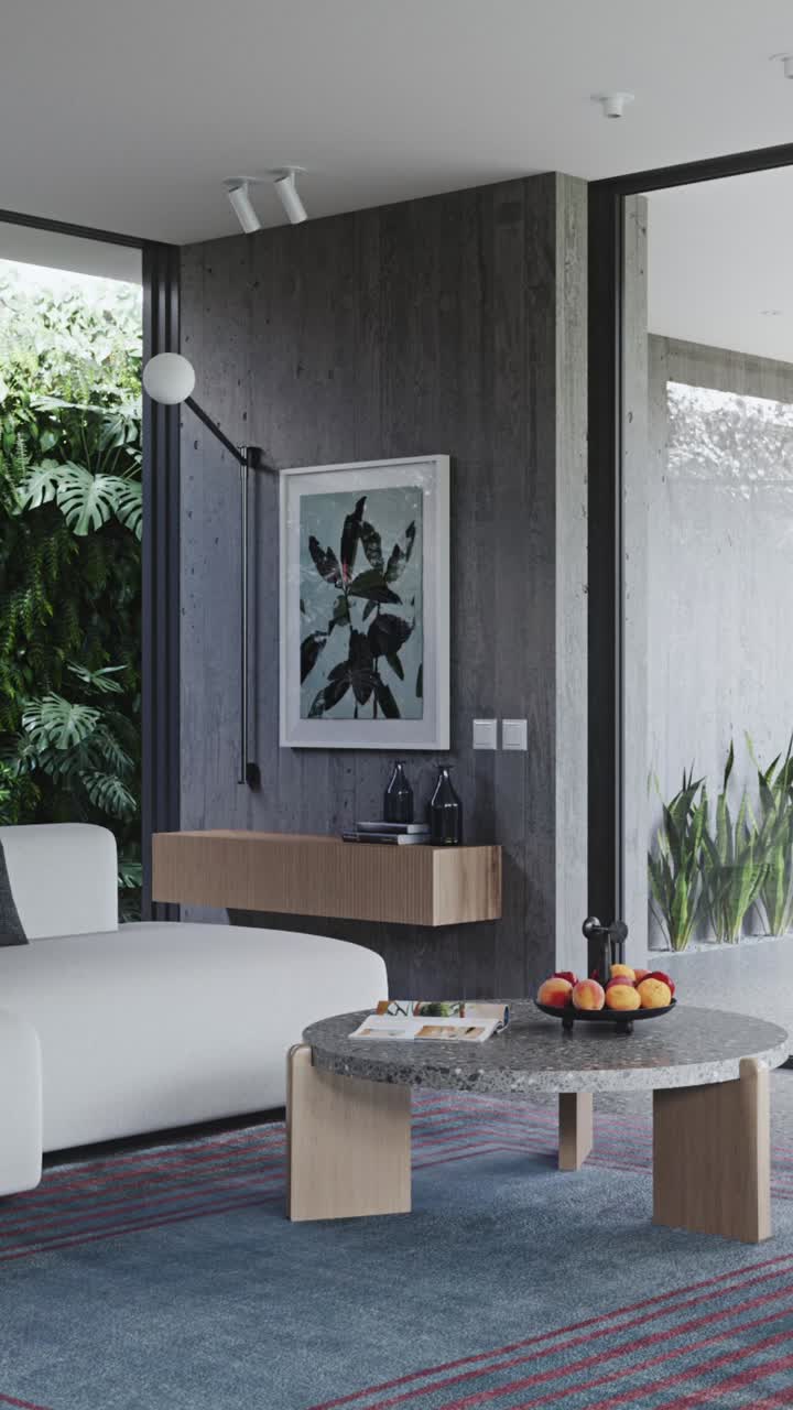Design moderno di un soggiorno in una casa immersa nel verde e nella luce