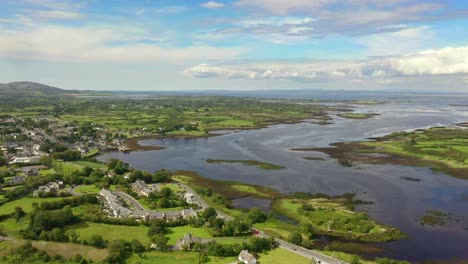 kinvara, galway, ireland, august 2020, drone flying high while slowly tracking parallel to fishing village