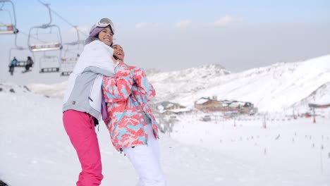 Two-cute-attractive-young-women-at-a-ski-resort