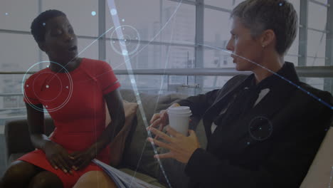Animation of networks of connections over diverse business people talking in office