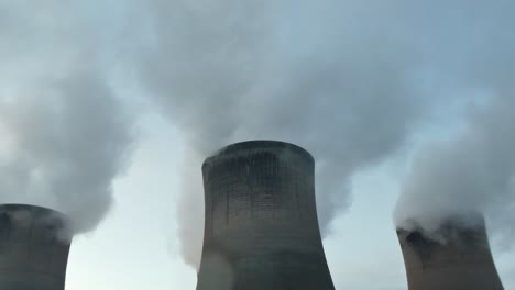 power plant cooling towers fossil fuel smoke air pollution from below chimney stacks