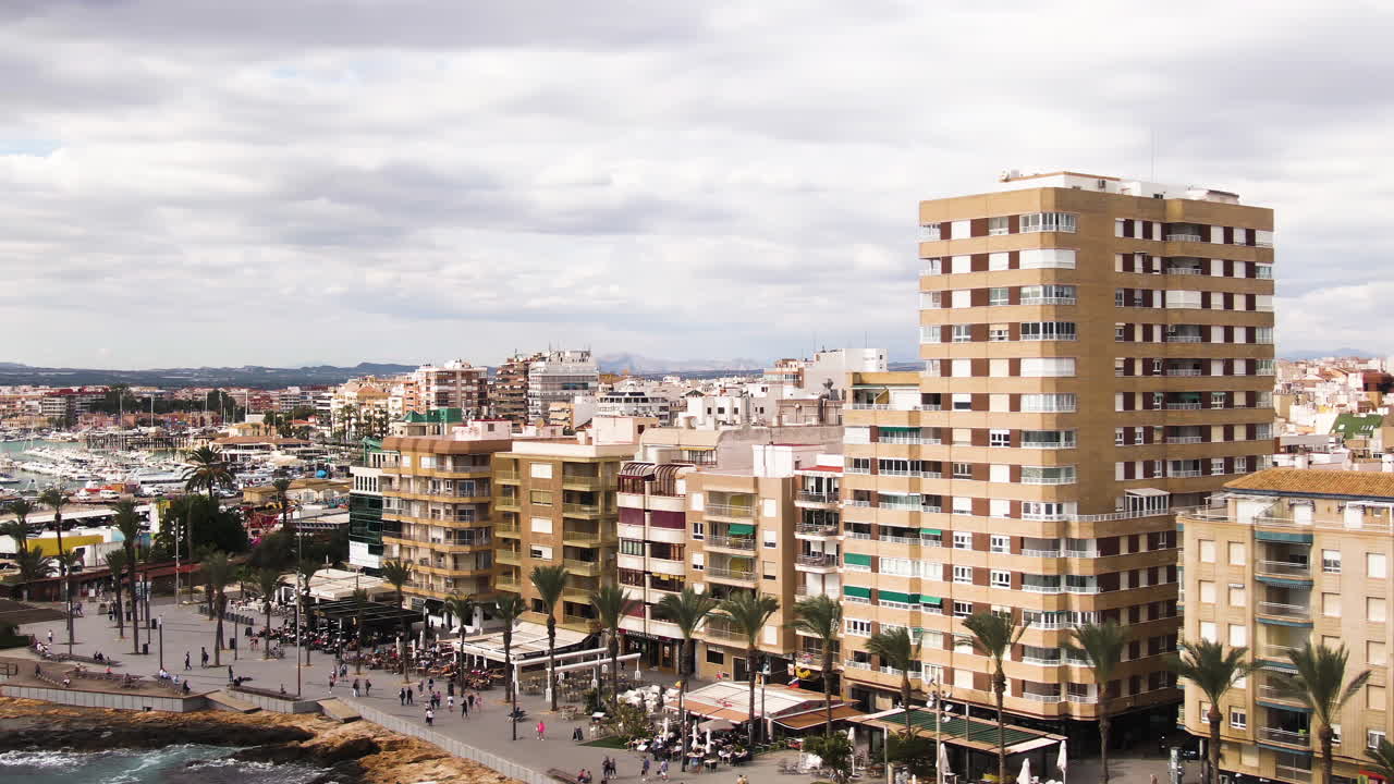 Apartment buildings of Torrevieja city in Spain, aerial orbit view