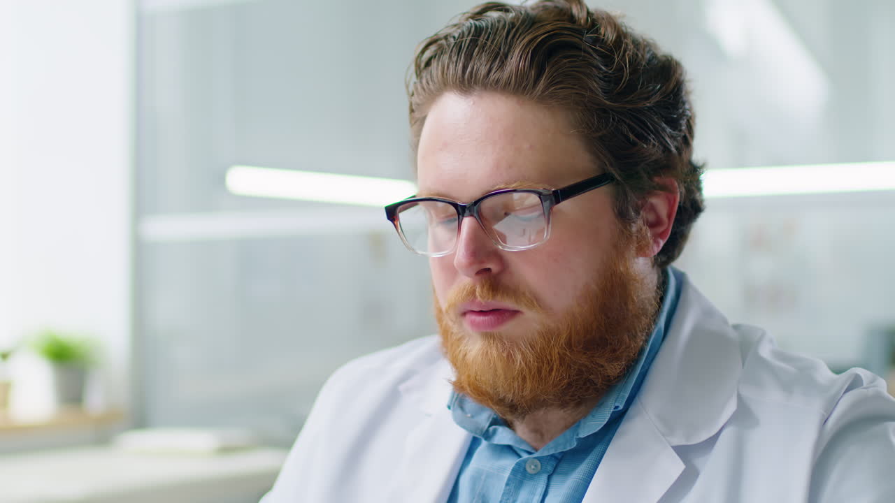 Doctor Using Computer during Workday