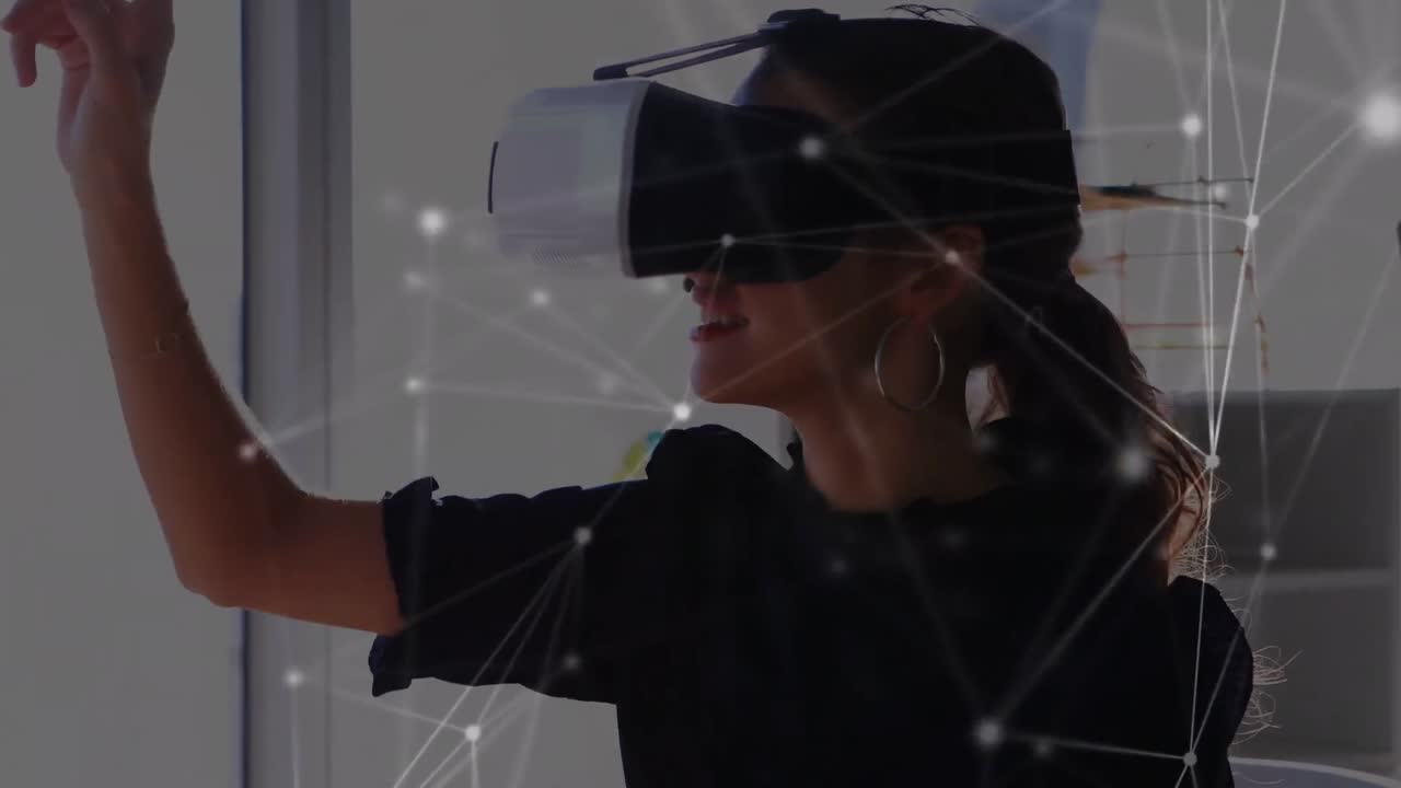 Animation of network of connections over businesswoman wearing vr headsets