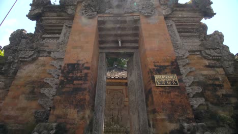 statue of saraswati seen through a doorway