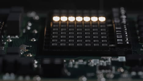 close-up of a circuit board with a lit led display