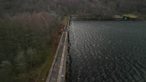 flying along reservoir dam wall at haweswater english lake district uk