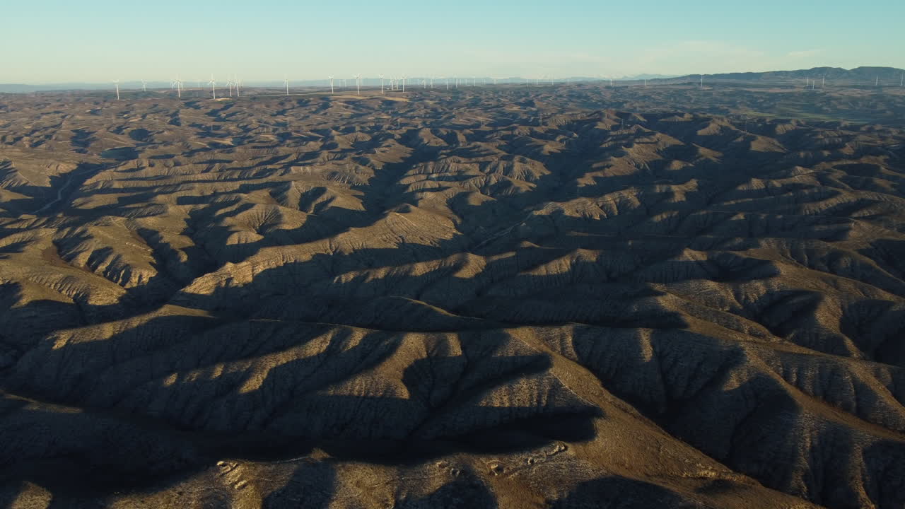 Aerial View of a Desert Landscape with Wind Turbines