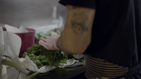 chef preparing fresh herbs