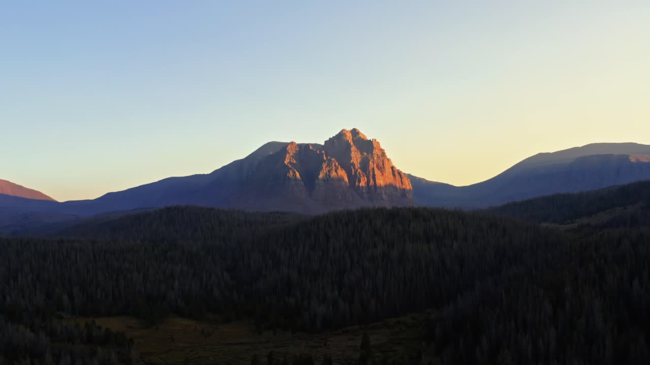 Stunning aerial drone landscape nature right trucking shot of the beautiful Red Castle Lake mountain up in the high Uinta's between Utah and Wyoming on a backpacking trip during a summer sunset