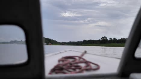 serene river journey: a boat ride through a cloudy landscape