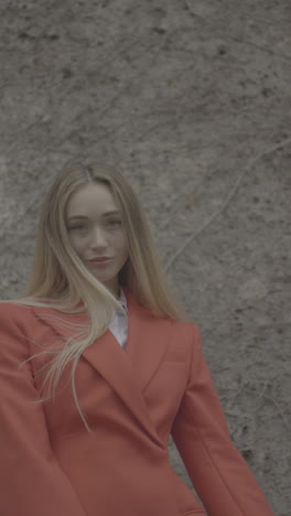 woman in an orange blazer