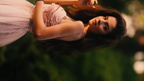 Shot-of-a-young-female-model-posing-in-front-of-a-camera-during-an-outdoor-shoot