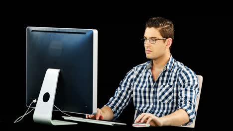 man working on desktop