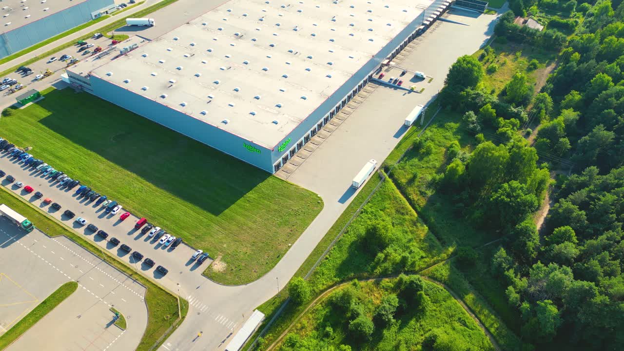 Aerial view of warehouse storages or industrial factory or logistics center from above