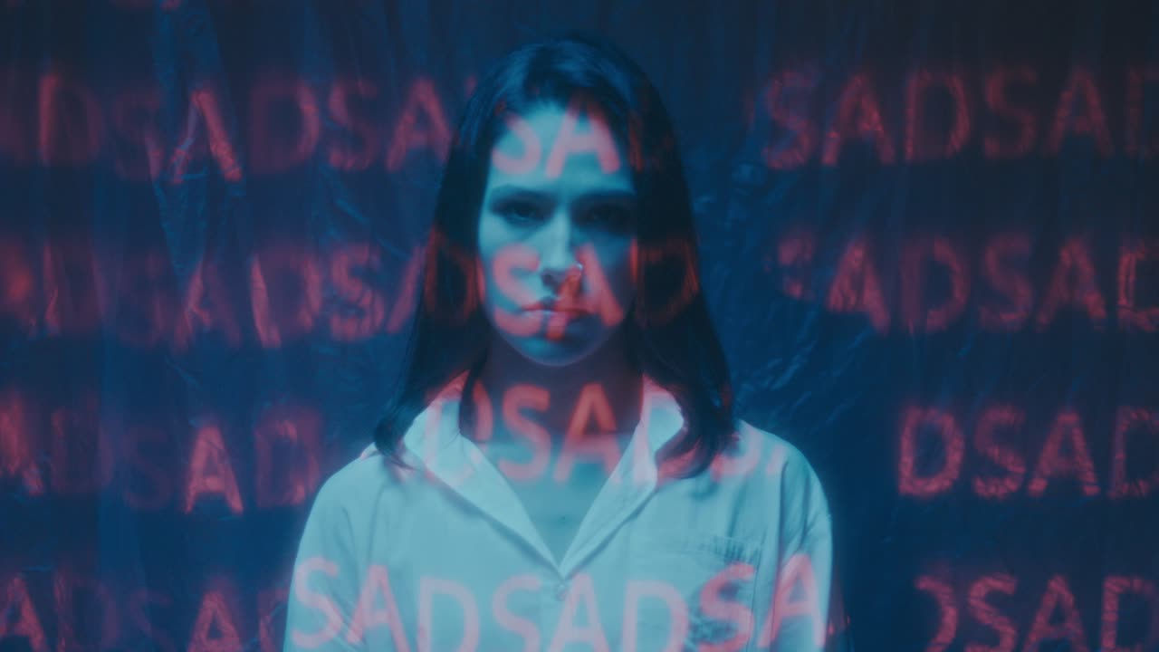 Woman Under Projected Text