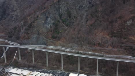 egratz viaduct bridge - a long, curved concrete highway bridge in the french alps - aerial panorama