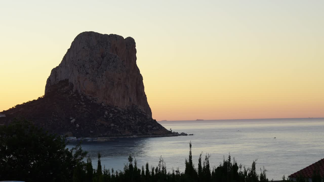 Iconic Massive Rock Of Penyal d'Ifac Natural Park In Calpe, Alicante, Spain. Wide Shot
