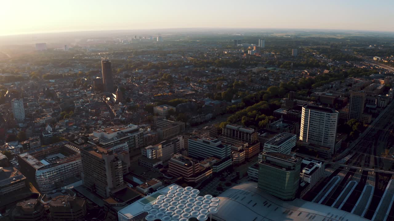 Drone Aerial Landscape Of Utrecht City Center With Dom Tower. Empty Central Railway Train Station Due To The Pandemic Coronavirus In The Netherlands At Sunset Time
