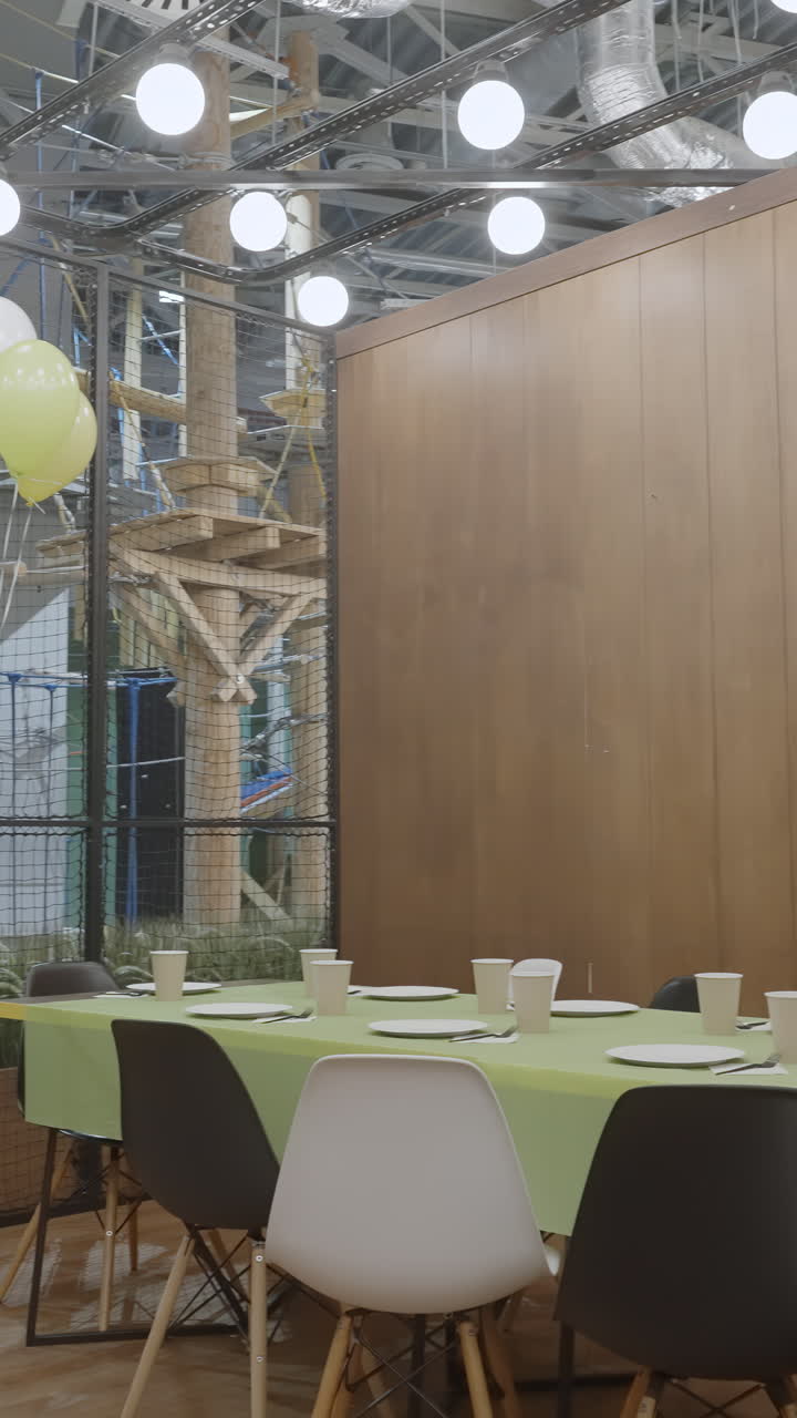 Empty kids' party area with tables and chairs