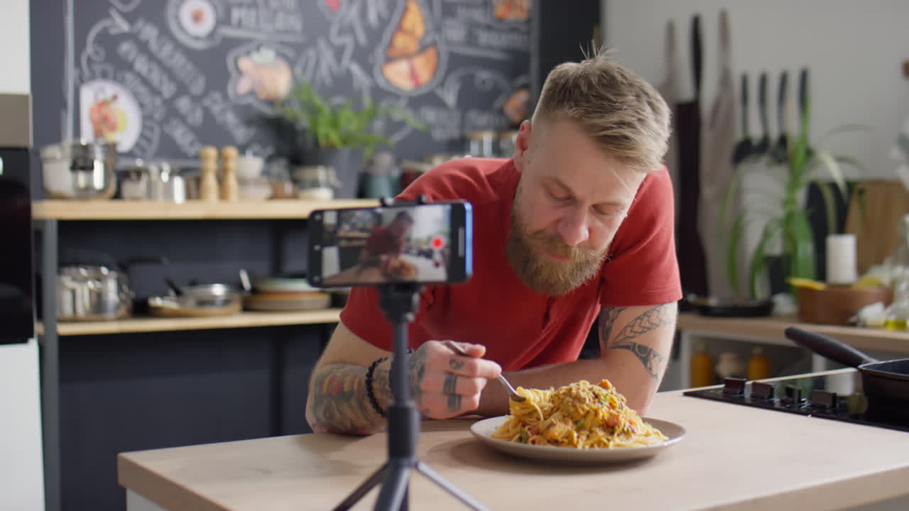 Food Blogger Eating Spaghetti and Talking on Camera
