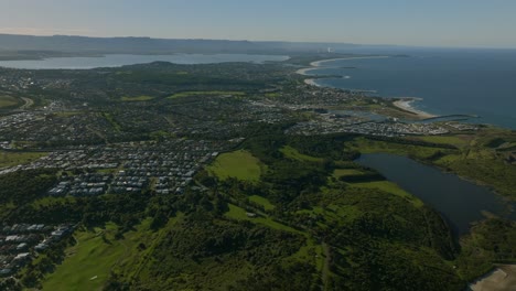 uni wollongong shell cove shellharbour marina waterfront the farm surfing break mystics lake illawarra state park aerial drone australia nsw sydney south coast mining coastal sunny blue sky forward