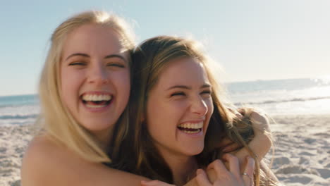 happy woman hugging girl friend on beach giving suprise kiss on cheek best friends having fun summer vacation