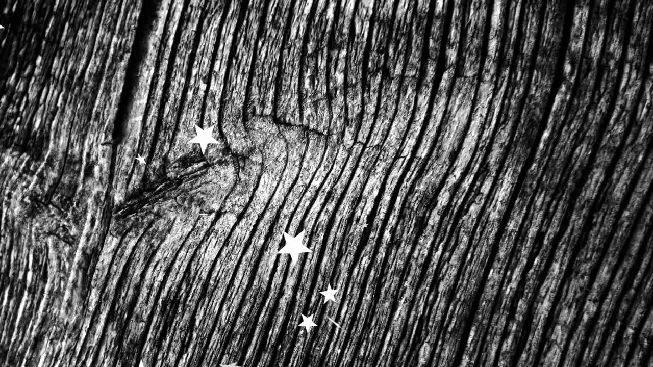 Animation of stars scattered on textured wooden surface in school setting