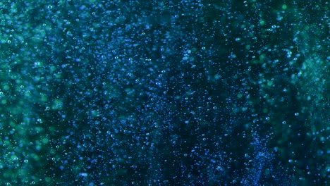 bluegreen bubbles create a deep three dimensional parallax on a black background