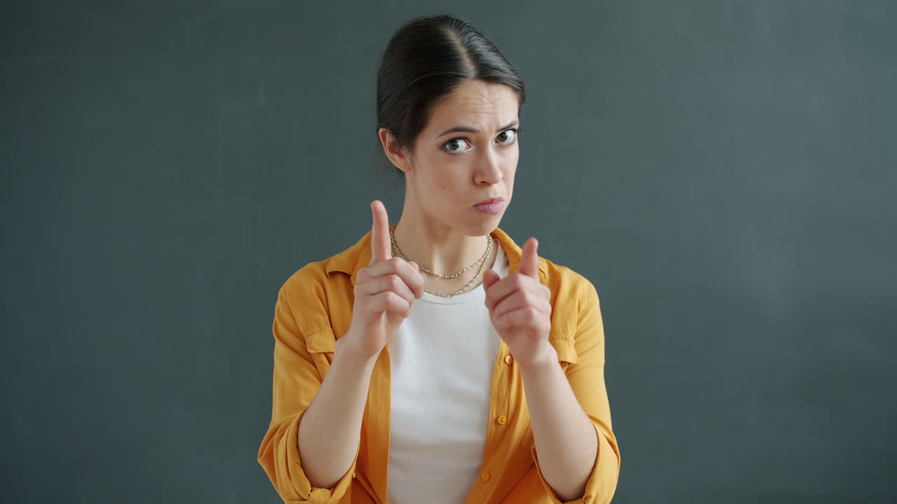 Woman Pointing with Disapproval