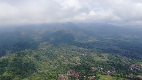 majestic landscape with mountains and villages in indonesia, aerial view