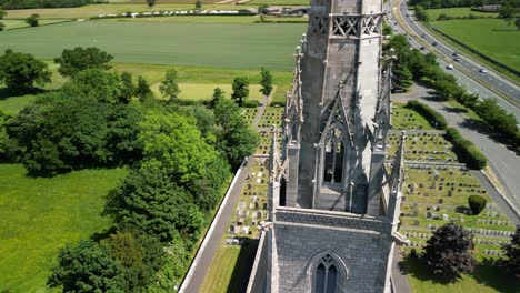 the marble church, bodelwyddan, wales - neo-gothic, ariel drone anti-clockwise pan, in close, focus on steeple, move out and reveal church - june 23