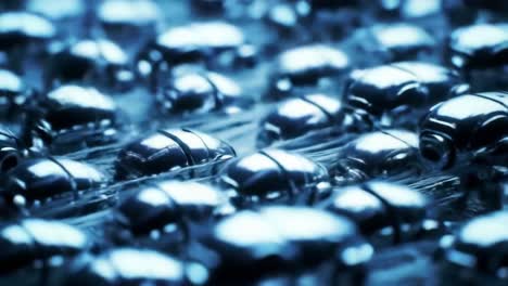 an intricate close-up of polished metallic beads reflecting light, showcasing detail and texture in a mesmerizing pattern