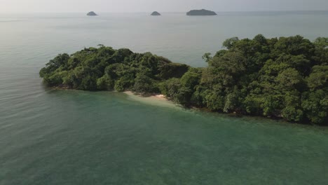 aerial drone orbit small deserted tropical island in gulf of thailand