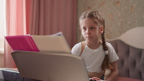 Schoolgirl-stands-by-synthesizer-flipping-pages-with-notes