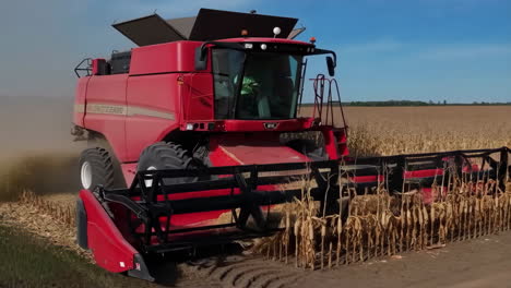 a combine harvester harvesting corn in a field