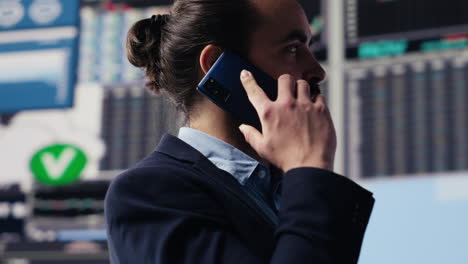 expert businessman on a smartphone call discussing finance and analytics