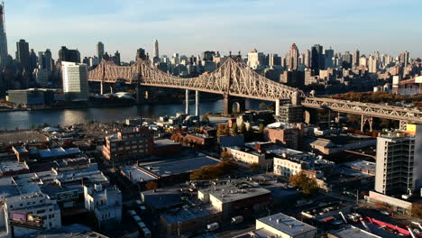 queensboro bridge over east river and roosevelt island at sunset in new york city, usa