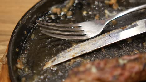 empty dirty plate with utensils