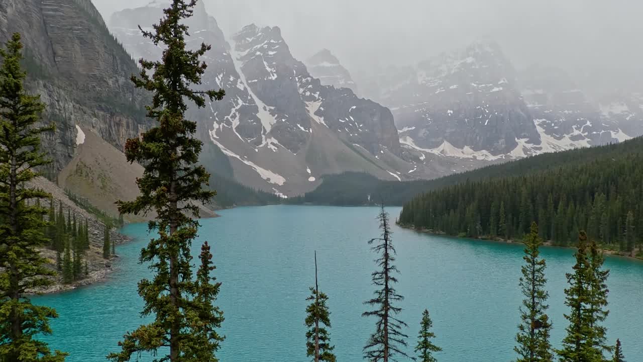 View overlooking the beautiful azure blue waters of Moriane Lake in Banff National Park in Alberta Canada