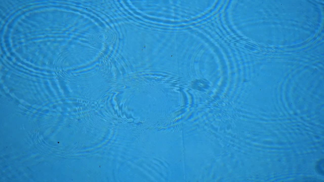 Raindrops on water