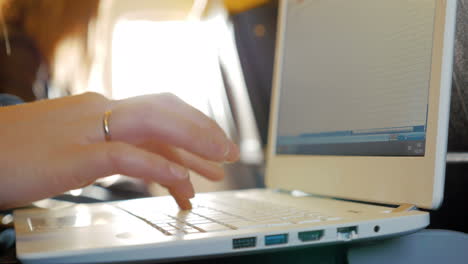 female fingers typing on the keyboard