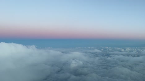 winter sky view from a jet cockpit descending to ibiza’s airport, spain, during the sunset